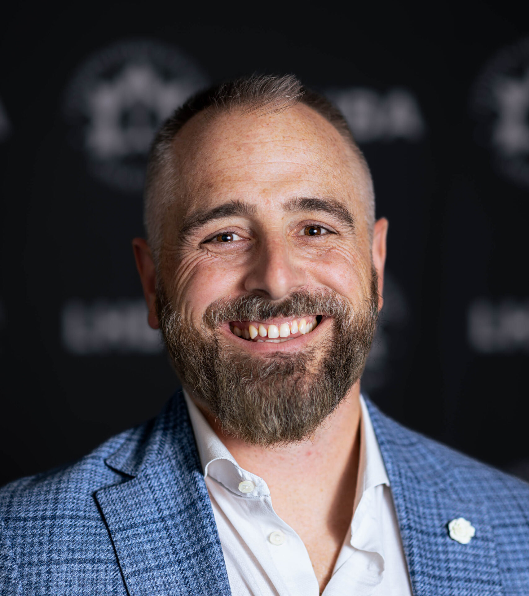 Adam-Carapella-Headshot-Web-scaled-e1747924770413